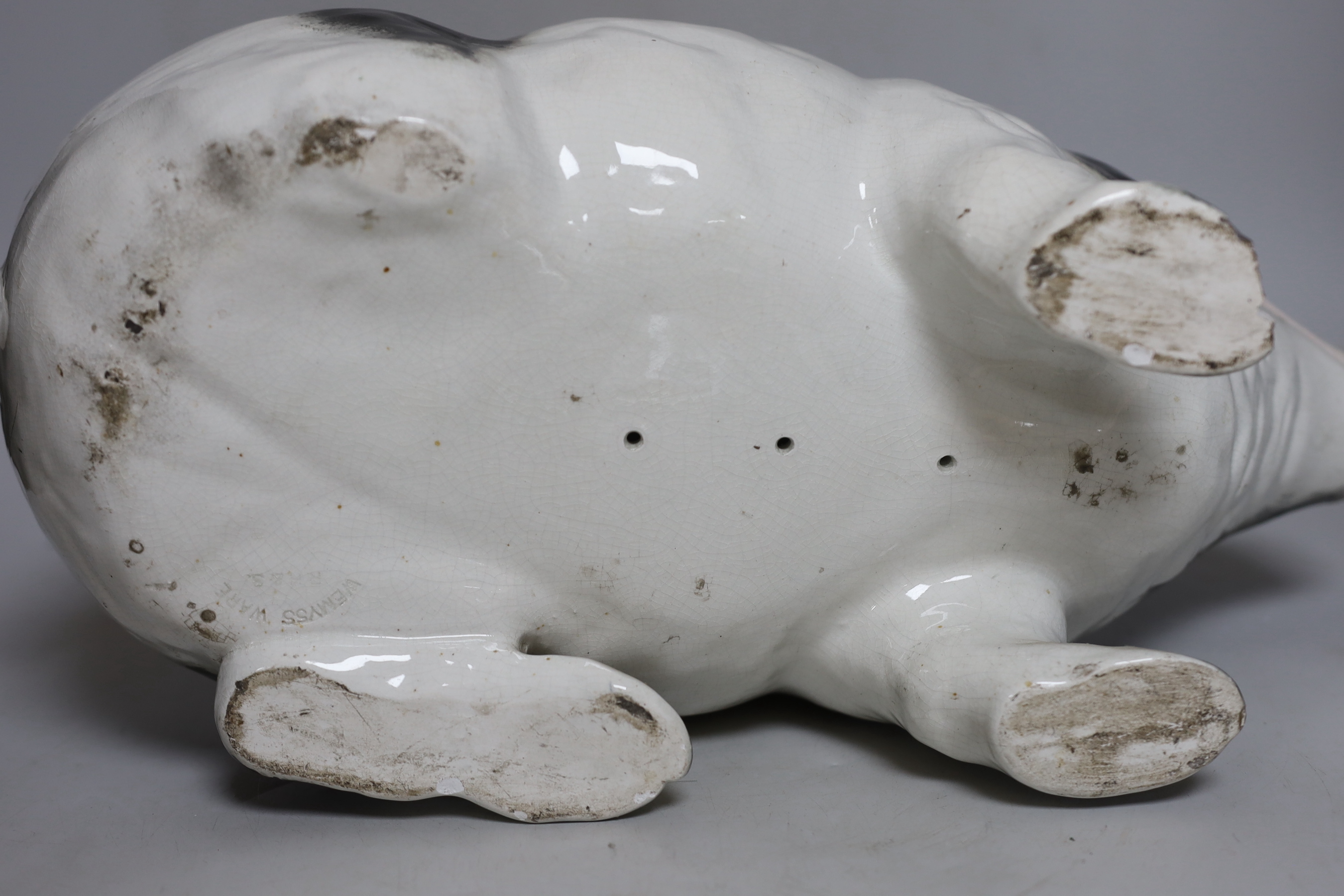 A large and rare Wemyss pig, with top hat and monocle, impressed mark WEMYSS WARE, R.H. & S, 45cm in length, a/f